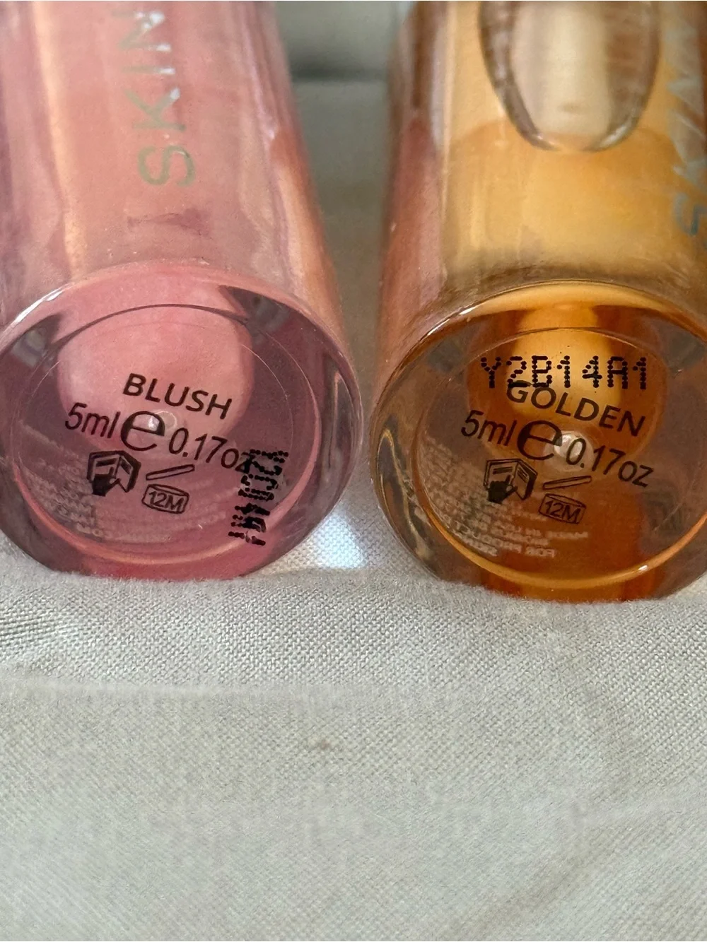 New and Sealed 2-SKINN Luminous Lip Oil in Golden and Blush